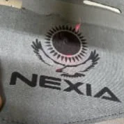 Nexia жазуы және Елтаңба